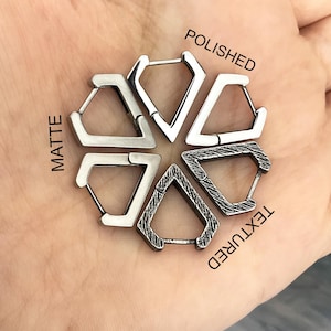 May include: Six silver-colored hoop earrings with a geometric design are displayed. The earrings have different finishes: matte, polished, and textured. The word "POLISHED", "MATTE", and "TEXTURED" are printed on the image.