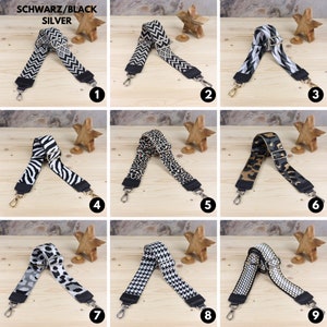 May include: Nine different patterned adjustable straps for bags, with silver hardware. The straps are made of black, white, and brown fabric with various patterns, including zebra, leopard, and geometric designs.