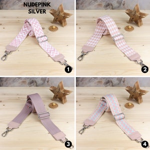 May include: Four different patterned and solid color fabric straps with silver hardware. The straps are for bags and purses.  The straps are on a wooden surface.