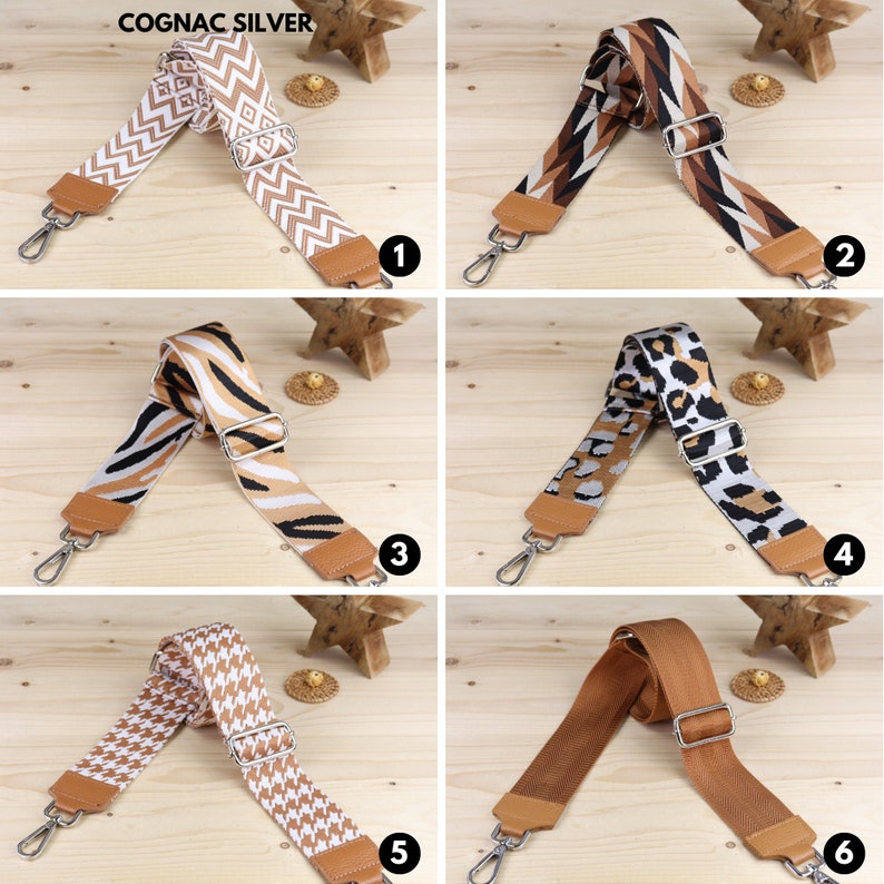 May include: Six different patterned brown and white fabric straps with silver clasps. The straps are shown on a wooden surface.  The straps are numbered 1 through 6.