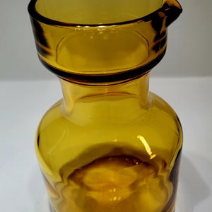 Vintage mid century yellow tinged/orange pess molded , made in Italy transparent glass with spout , honey gold color vase/ carafe