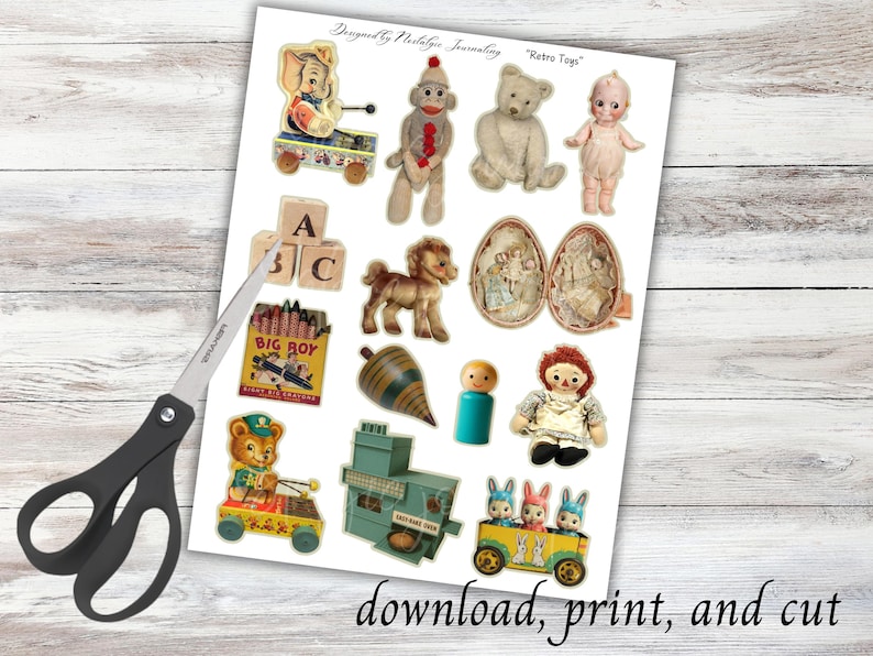 May include: A sheet of paper with vintage toy images, including a teddy bear, doll, and toy train. The text "Retro Toys" is at the top. The words "download, print, and cut" are at the bottom. A pair of scissors is on the left.