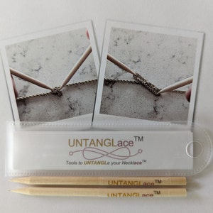 May include: Two wooden sticks with the text "UNTANGLACE TM" are shown in a clear plastic pouch. The sticks are used to untangle necklaces. Two images of a gold chain being untangled with the sticks are shown on the back of the pouch.