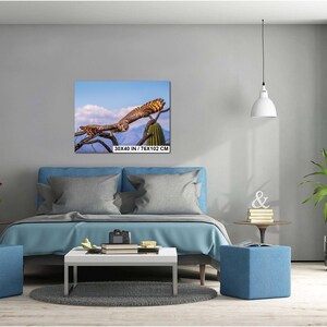 May include: A framed canvas print featuring a detailed image of an owl perched on a tree branch. The owl has brown and tan feathers, with a blue sky and mountain backdrop. The print is labeled "30x40 IN / 76x102 CM".