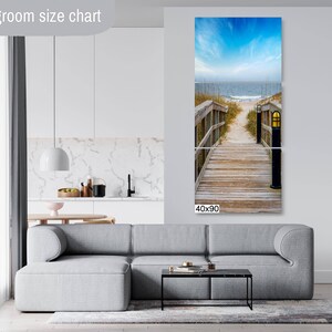 May include: A three-panel canvas print depicting a wooden walkway leading to a beach with blue sky and ocean in the background. The print is 40 inches wide by 90 inches tall.