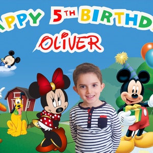 May include: A birthday banner with the words "Happy 5th Birthday Oliver" in colorful letters. The banner features Mickey Mouse, Minnie Mouse, Goofy, Pluto, and a baby Mickey Mouse.