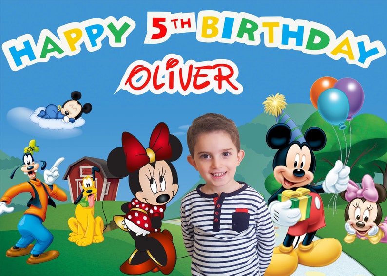 May include: A birthday banner with the words "Happy 5th Birthday Oliver" in colorful letters. The banner features Mickey Mouse, Minnie Mouse, Goofy, Pluto, and a baby Mickey Mouse.