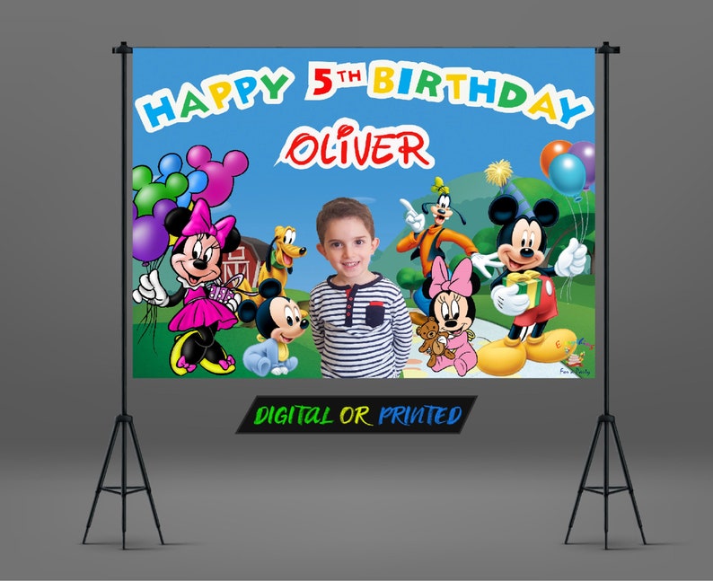 May include: A colorful birthday banner with Mickey Mouse, Minnie Mouse, and Goofy characters. The banner says "Happy 5th Birthday Oliver" and has a blue background with green grass and a red barn.