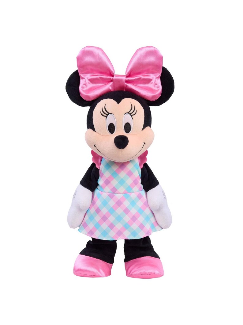 May include: A plush Minnie Mouse doll with a large pink bow, black ears, and a checkered dress in pink and blue. The doll has white gloves and pink shoes. The background is plain white.