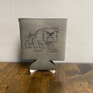 May include: Gray leather can cooler with a black and white cartoon bulldog graphic.