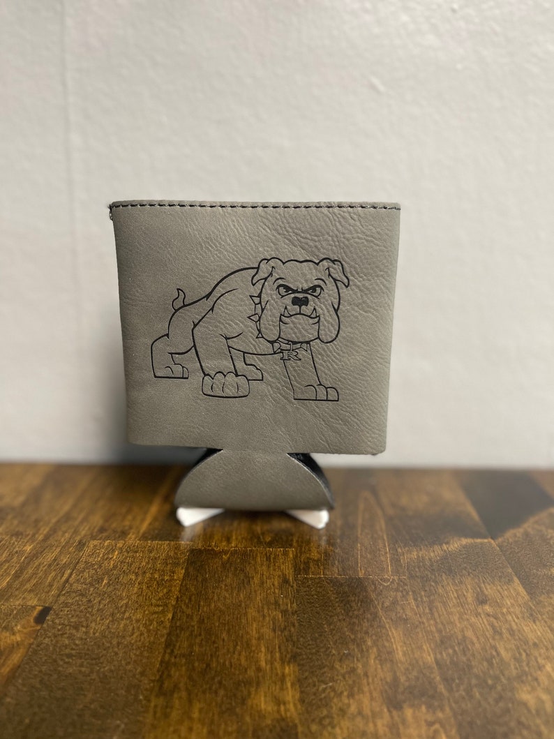 May include: Gray leather can cooler with a black and white cartoon bulldog graphic.