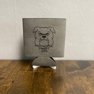 May include: A gray leather can cooler with a black bulldog graphic and the letters "IR" printed on it.