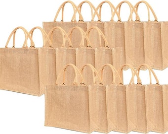 May include: A collection of fifteen rectangular tote bags made from tan-colored woven jute fabric. Each bag features two matching tan fabric handles attached to the top edge, with a structured base and sides, arranged in three rows of five units.