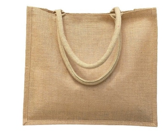 May include: A natural beige jute tote bag with thick rope handles. The bag is made of a woven fabric and has a natural, earthy look.