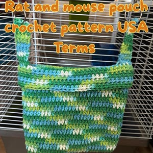 May include: A handmade crochet pouch for small pets, featuring a mix of green, blue, and white yarn. The pouch is designed to hang inside a cage and has the text "Rat and mouse pouch crochet pattern USA Terms".