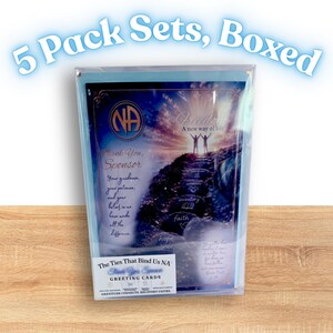 May include: A boxed set of greeting cards with the text "5 Pack Sets, Boxed". The cards feature a scenic image with the words "Freedom, A new way of life". The cards also have the text "Thank You, Sponsor" and "The Ties That Bind Us NA".