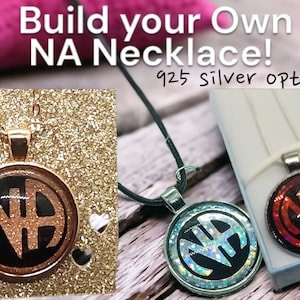 May include: Two necklaces with a black and white NA pendant. The pendant on the left has a gold chain and a glittery background. The pendant on the right has a silver chain and a red background. The text "Build your own NA Necklace! 925 Silver option!" is visible in the image.
