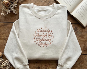 Dancing Through the Lightning Strikes Shirt, Embroidered Quote Sweatshirt, Orange Girl Concert Tee, Inspiring Gift for Her