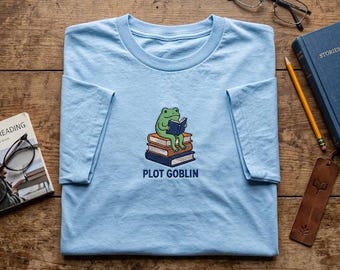 Embroidered Plot Goblin Tee, Cute Frog Book Lover Shirt, Aesthetic Reader T-Shirt, Bookish Gift for Her, Cute Bookworm Toad Apparel