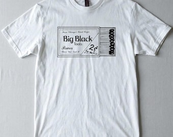 May include: White t-shirt with a black graphic design. The design resembles a matchbox, with the text "Big Black Tools" and "Power Where You Need It". The price is listed as 2¢.