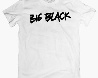 May include: White t-shirt with the text "BIG BLACK" printed in black.
