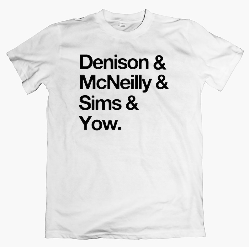 May include: White t-shirt with black text that reads "Denison & McNeilly & Sims & Yow."