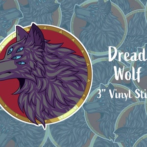 May include: A 3-inch vinyl sticker featuring a purple wolf with multiple eyes. The wolf is surrounded by a gold circle with a red background. The text "Dread Wolf" and "3" Vinyl Sticker" is printed below the wolf.