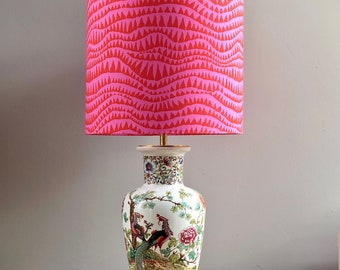 Table lamp made of a Chinese vase, decorated with blossom branches, birds and flowers. Fuchsia lampshade