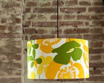 Hanging lamp in vintage fabric. Sixties, seventies style. In yellow, green and orange.