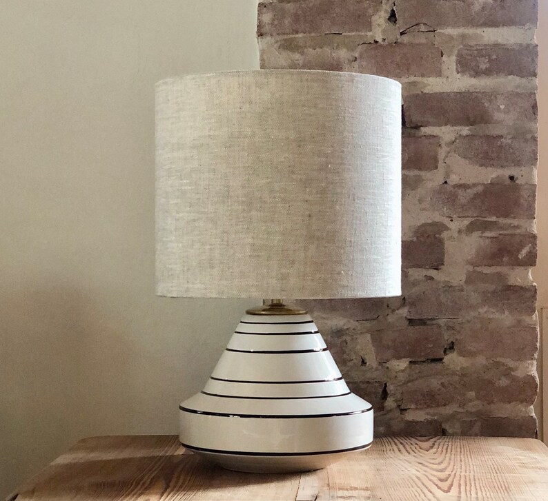 Table lamp in neutral colors, ceramic vase in special shape in white and black. Linen hood. image 1