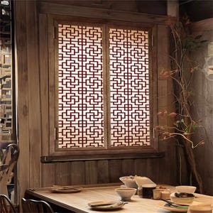 Puede incluir: Una ventana de madera con un diseño de celosía roja. La ventana está enmarcada en madera y está rodeada por una pared de madera. La ventana está abierta y hay una mesa y sillas delante de ella.