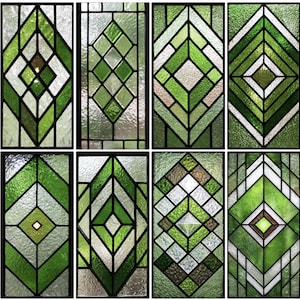 May include: Eight stained glass panels with geometric designs in shades of green, white, and clear glass, outlined with black lines. The panels feature diamond, square, and rectangular shapes, creating a decorative and artistic display.