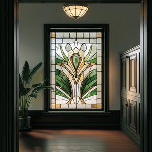 May include: A stained glass window with a green, yellow, and brown floral design. The window is set in a dark wood frame and is surrounded by a white wall.