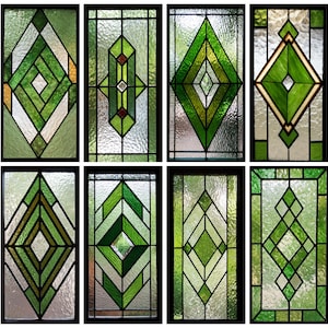 May include: Eight stained glass window panels with geometric designs. The panels feature shades of green, with black borders. The designs include diamond and chevron shapes. The glass has a textured appearance, adding depth to the artwork.