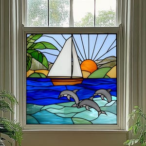 May include: Stained glass window panel depicting a sailboat on blue water with dolphins, a setting sun, and palm trees. The artwork features a vibrant color palette of blues, oranges, greens, and white, framed in a neutral tone.