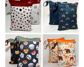 Wetbag sets of 2 in different designs with name print: rainbows, dots, stars, forest animals, bears. esthetic. sustainable. functional.