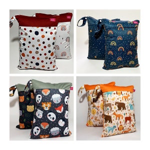 Wetbag sets of 2 in different designs with name print: rainbows, dots, stars, forest animals, bears. esthetic. sustainable. functional.