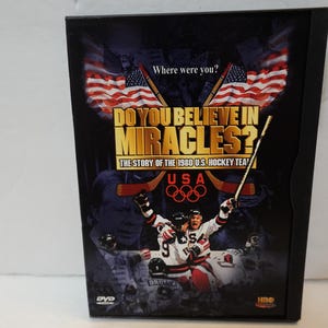 May include: DVD case for "Do You Believe in Miracles?" The cover features the title in gold, the USA Olympic rings, and a hockey player celebrating. American flags and the text "Where were you?" are also visible.