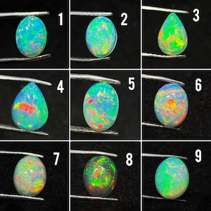 May include: A grid of nine loose opals held by metal tweezers, each displaying a unique play of color with flashes of neon green, orange, and red against a translucent white or dark base. The stones are numbered one through nine in white text.