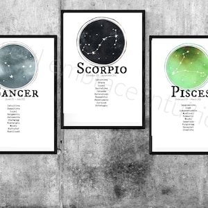 May include: Three framed prints with watercolor backgrounds and constellations. The prints are labeled "Cancer", "Scorpio", and "Pisces" with their corresponding dates and personality traits listed below.