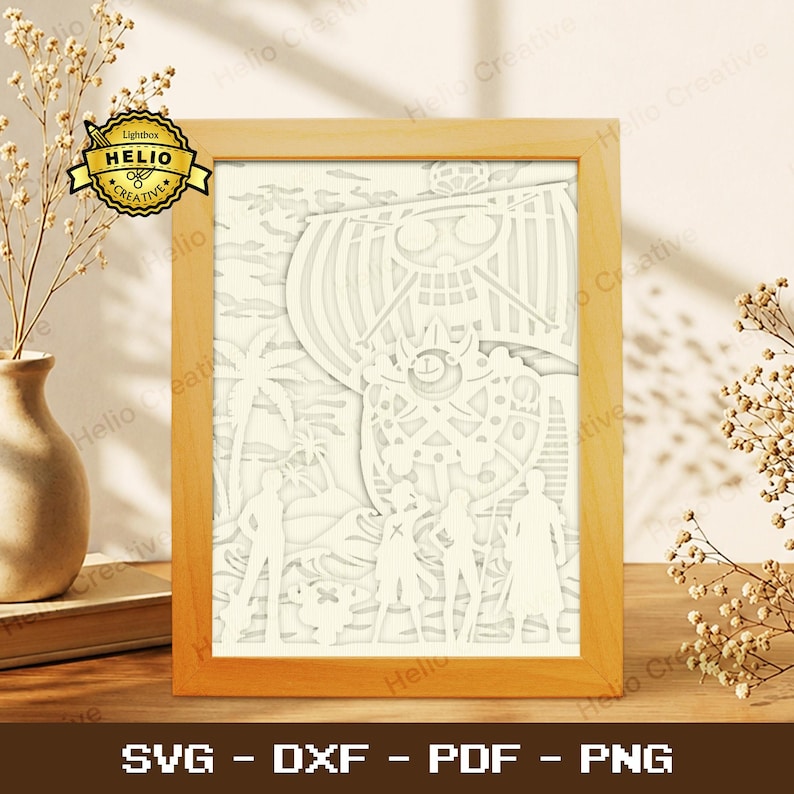May include: A light wood-framed paper cut art piece featuring a layered white scene of a ship with a skull emblem, palm trees, and four figures standing on a beach. The artwork includes the text Lightbox HELIO CREATIVE in the corner.
