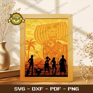 May include: A rectangular light wood frame containing a layered paper art piece with a yellow and orange sunset background. The silhouette design features a pirate ship with a skull emblem and four characters standing on a beach with palm trees.