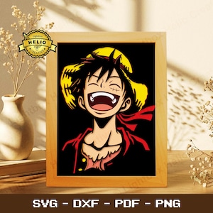 May include: A framed illustration of a smiling anime character with a straw hat and red scarf. The character has black hair and a scar under their left eye. The background is black. The frame is made of light-colored wood. The bottom of the frame has the text "SVG - DXF - PDF - PNG".