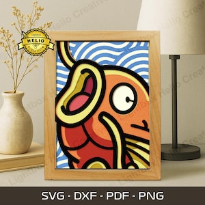 May include: A framed, layered paper art piece featuring a cartoon fish in shades of orange, red, and yellow, set against a blue and white wavy background. The artwork is in a light brown wooden frame. The bottom of the frame displays the text: SVG - DXF - PDF - PNG.