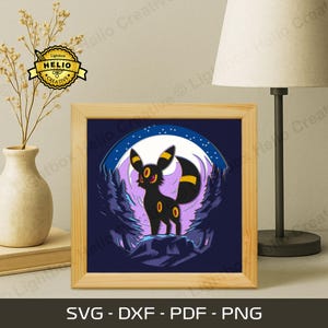 May include: A framed print featuring a black cartoon creature with yellow accents, set against a purple forest and a full moon. The artwork is in a wooden frame. The bottom of the frame displays the text "SVG - DXF - PDF - PNG".