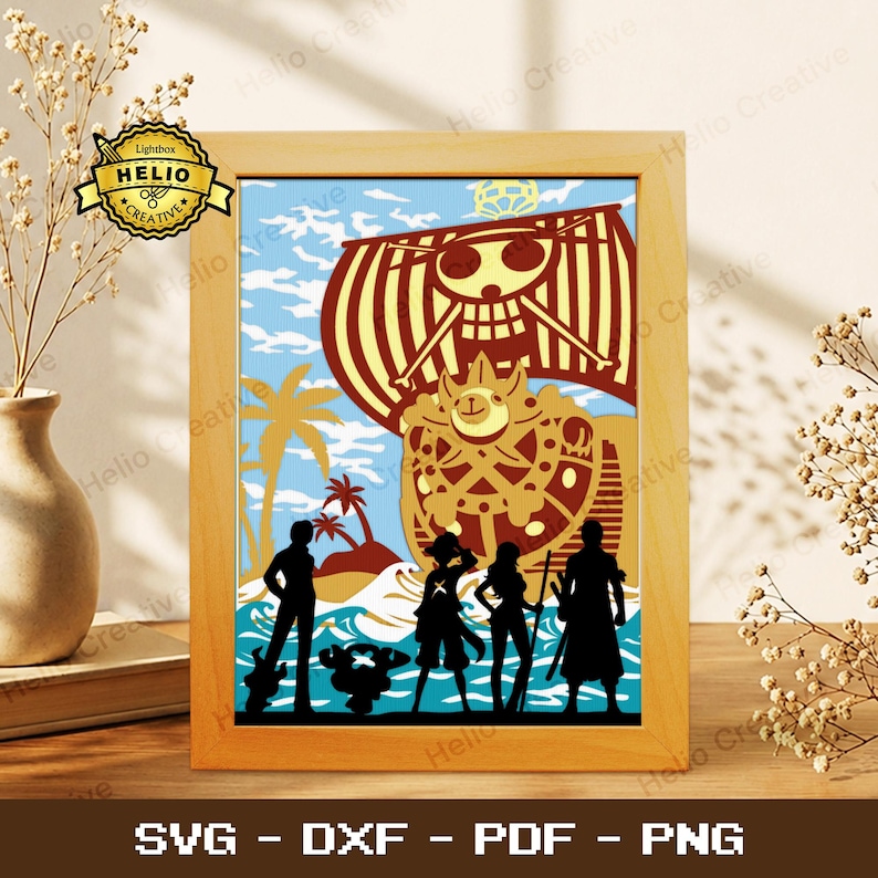 May include: A framed paper art piece featuring a silhouette of the One Piece Thousand Sunny ship and five characters against a blue sky and ocean background. The ship displays a skull and crossbones emblem on its large yellow sail.