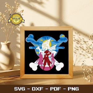 May include: Wooden framed art print featuring a pirate-themed design. The artwork showcases a skull and crossbones with a ship, figures, and a blue and yellow color scheme. The bottom of the frame displays the text "SVG - DXF - PDF - PNG".