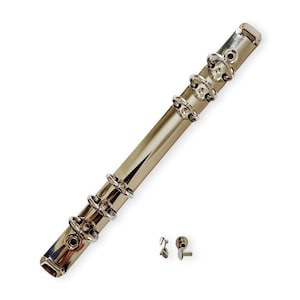 May include: A silver metal binder with four rings. The binder is designed to hold papers and documents. It comes with two small silver metal screws.