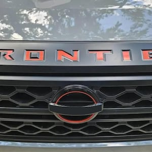 Stickers voor inkeping gebied Nissan Frontier-motorkap/-grille 2022-24
