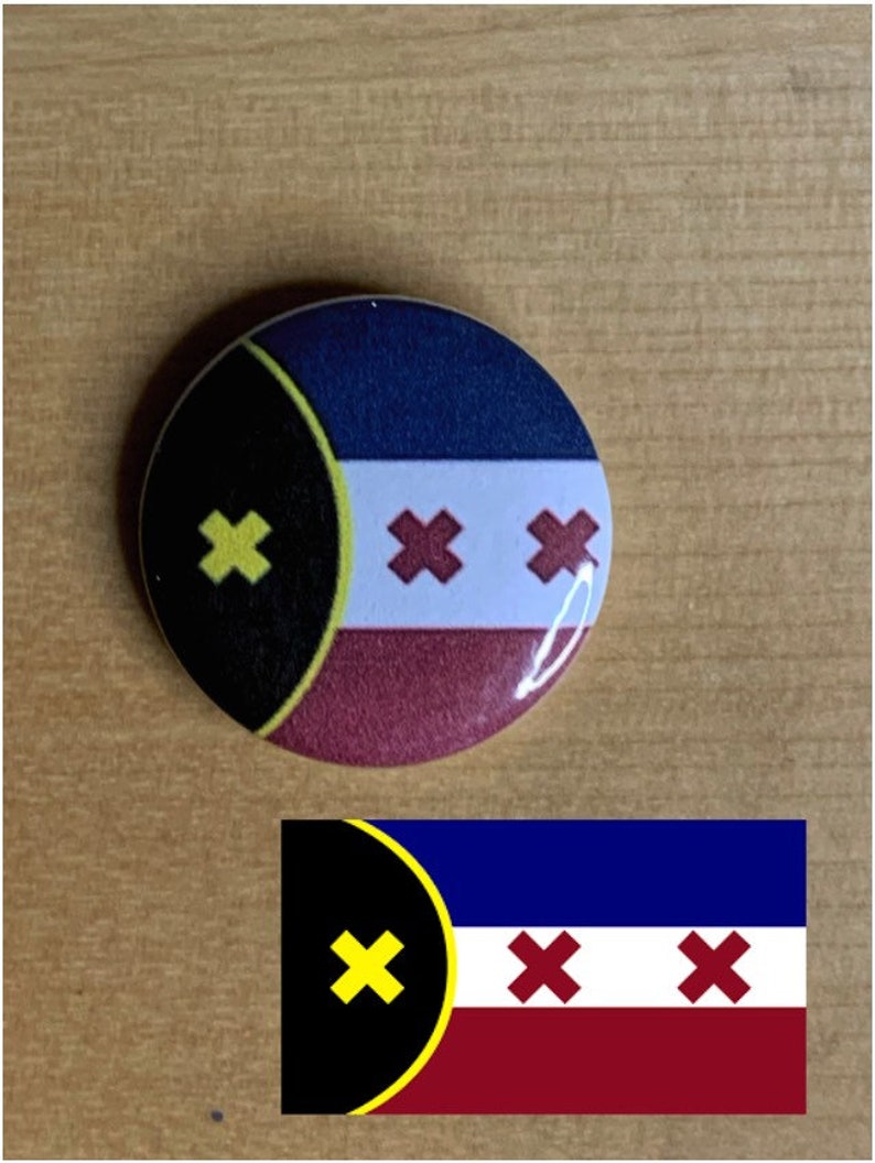 May include: A round button with a black, yellow, blue, white, and red flag design. The flag has a black circle with a yellow outline and a yellow X in the upper left corner. The rest of the flag is divided into three horizontal stripes: blue, white, and red. The white stripe has three red X's.